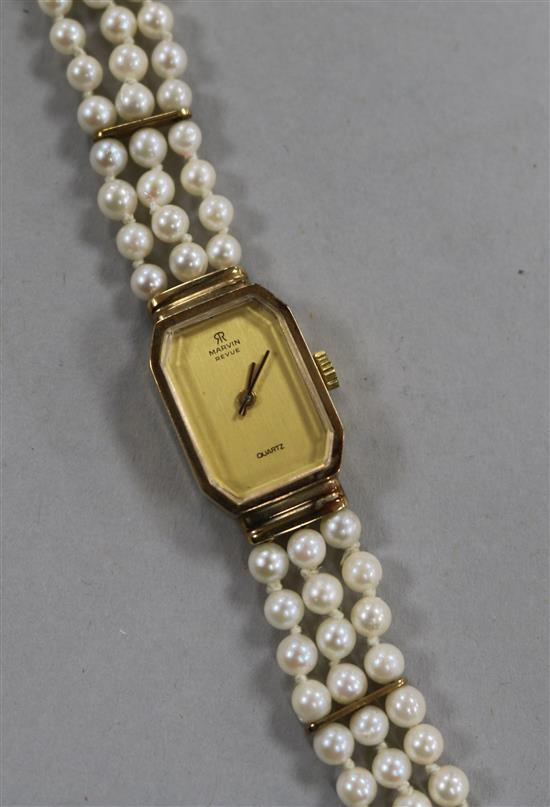 A Marvin Revue 9ct gold ladys quartz wrist watch, with cultured pearl bracelet strap.